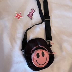 Black and Pink smiley face shoulder bag with stickers on photo